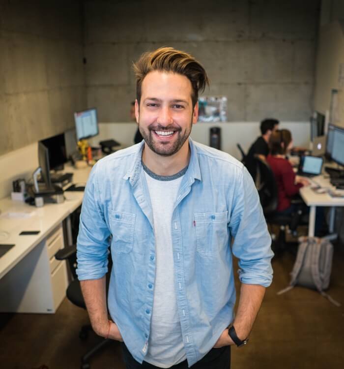 Man Standing with hands in Pockets Man Standing with hands in Pockets